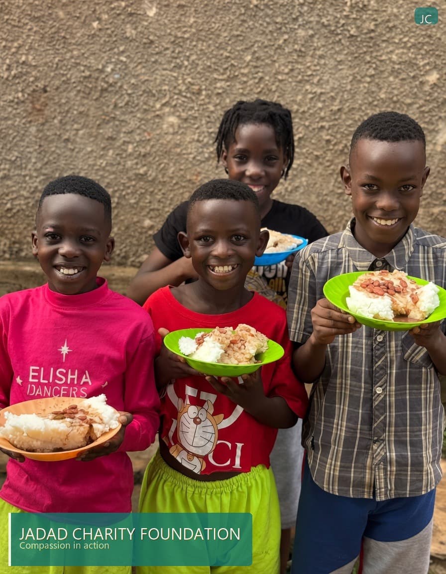 Children smiling with plates of food supported by Jadad Charity Foundation